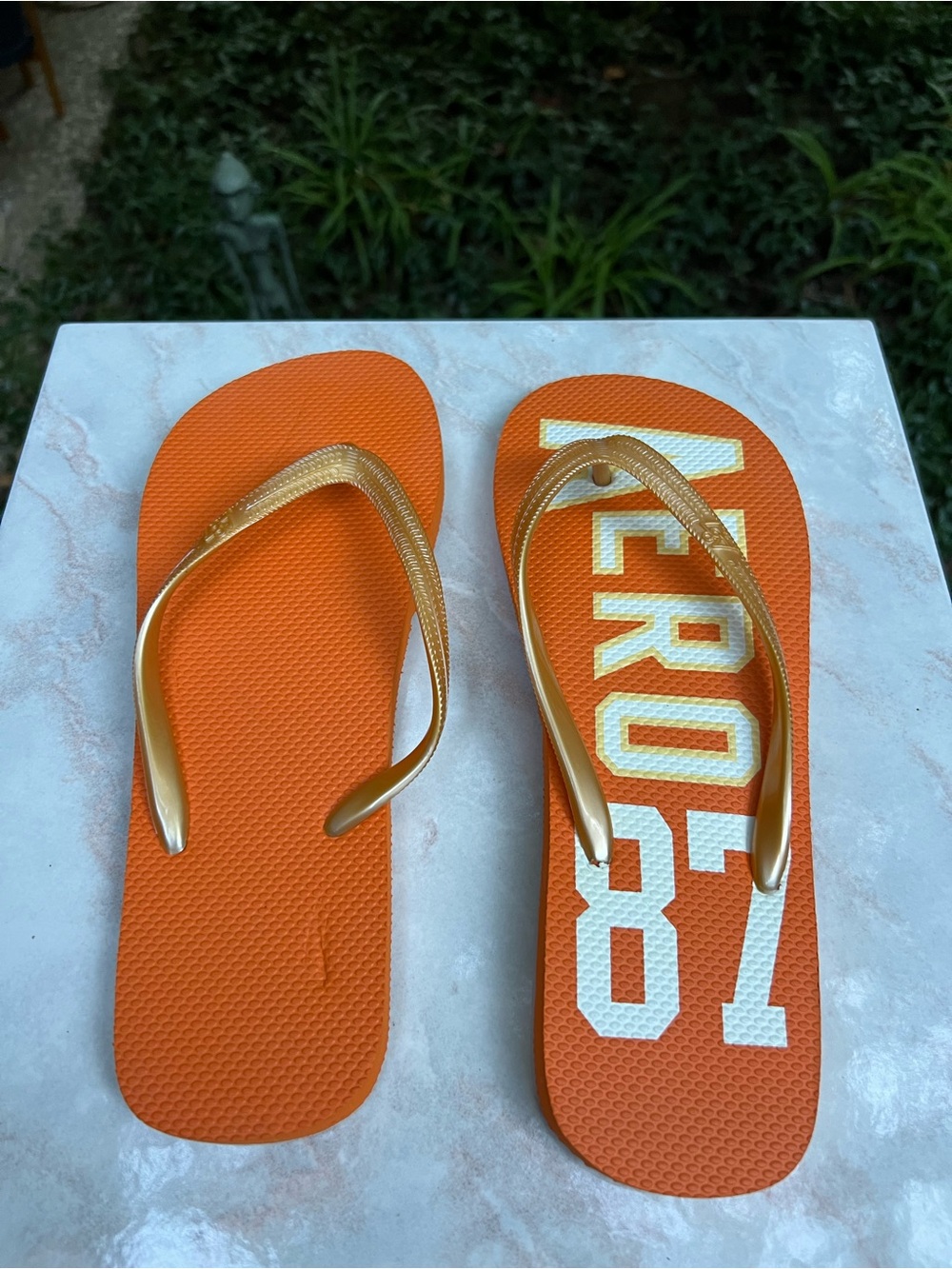 Orange Flip-Flops with Gold Straps